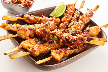 Dish of Grilled Meat on Wooden Skewers with Lime