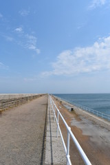 A deserted coastal promenade, St Catherine's Breakwater, Jersey Channel Islands, July, England, 2018