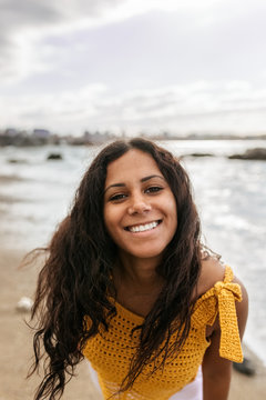 Portrait of a beautiful mixed race woman on the beach