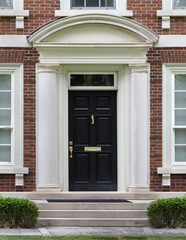 Fototapeta na wymiar elegant front door with stone frame
