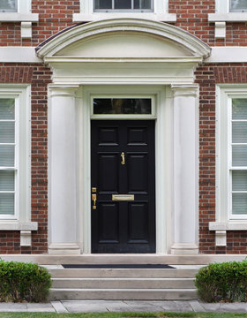 elegant front door with stone frame