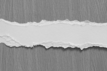 torn paper texture on wood background, copy space.