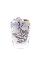 Money concept, coins inside or with the glass isolated over white background