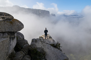 Man in VR headset on cliff