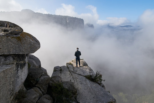 Man in VR headset on cliff