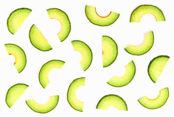 Avocado slices isolated on white background.