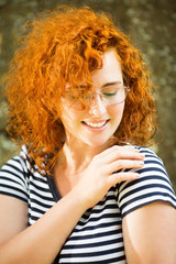 Young woman with ginger hair standing outside portrait