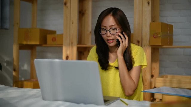 Young Asian Woman Working at home, Young business start up. Young Asian Woman Working at home, Young Owner Woman Start up for Business Online, SME, Delivery Project, Woman with Online Business or SME