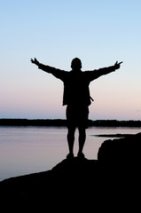 Silhouette of a Person Enjoying the Beauty of Nature