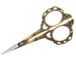 Scissors with curly handles from gold, isolated on white background