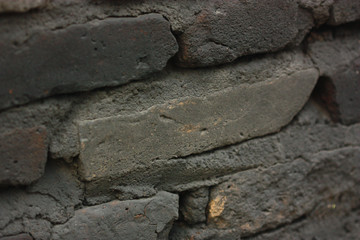 macro view of very old brown brick wall,very old and cool texture,cover by mud