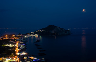 Eclipse of moon on Miseno beach, Naples (Italy), July 2018