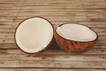 Half Coconut on wood table background.