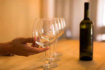 Bartender pouring a glass of wine at a bar. Wine tasting. Catering event.