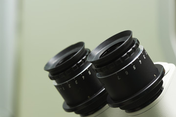 Close-up view of eyepieces of operating microscope