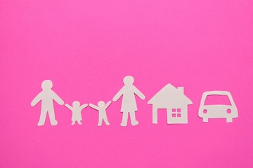 White paper happy family with home and car on pink background.