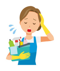 A woman wearing a blue apron and rubber gloves has several cleaning tools. And she is tired.