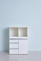White storage stand with ceramic and dishware in kitchen. modern kitchen furniture. japanese modern Kitchen storage furniture. Dining Room.