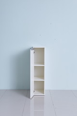 White storage stand with ceramic and dishware in kitchen. modern kitchen furniture. japanese modern Kitchen storage furniture. Dining Room.