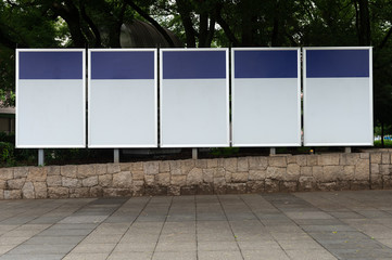 Large blank billboard on a street wall, banners with room to add your own text