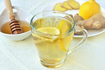Natural ginger tea, freshly brewed, with honey and lemon.