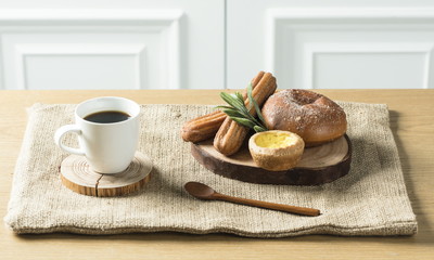 Close up view of bakers are working. Homemade bread. Eating breakfast with bread on the island table in the dining room. Morning coffee.