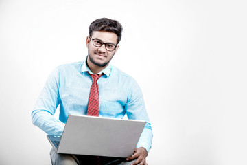 Young indian male using laptop