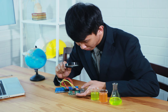 STEM education Laboratory. man coding a meta program it on the computer.electronic board that can be programmed.technology,Mathematics. science. engineering.