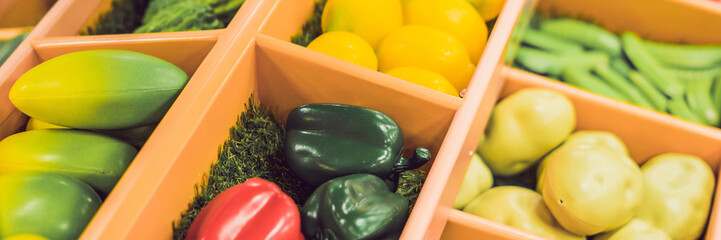 Plastic game, fake varied vegetables and fruits. Children food education toy BANNER, long format