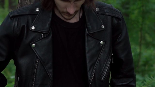 the guy in the leather jacket in the woods