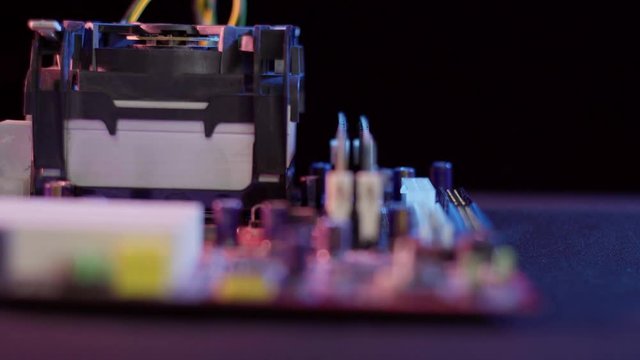 Close up view of an old pentium motherboard. The depth of field is short and has some rack focusing. The lighting is high contrast and still has room for color correction.