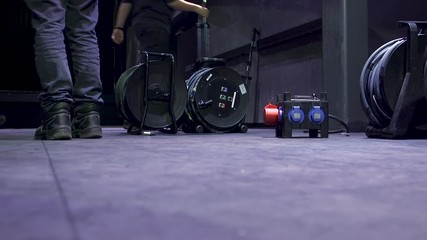 Technicians placing down the equipment for a concert