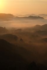 Sunset mountain silhouette fog