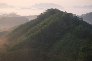 Fototapeta na wymiar Sunset mountain silhouette fog