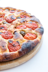 Focaccia typical of Bari Italy with tomatoes and olive