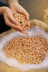 bag of peanuts with hands