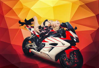 Fototapeta na wymiar Blonde girl on a sportbike on a yellow background