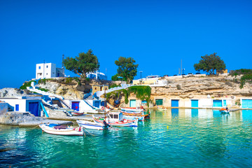 Scenic Mandrakia village (traditional Greek village by the sea, the Cycladic-style) with sirmata - traditional fishermen's houses, Milos island, Cyclades, Greece.