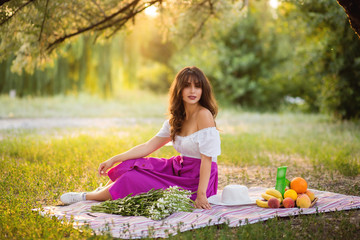 A woman at picnic in the park