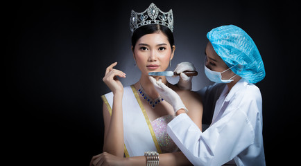 Miss Beauty Queen Pageant Contest with Diamond crown sash is checked up by Beautician Doctor