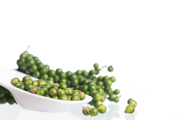 Fresh black pepper on white background