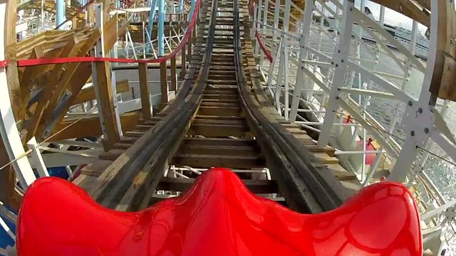 Amusement Park Excitement. A Fairground With Carnival Rides And Happy People.
