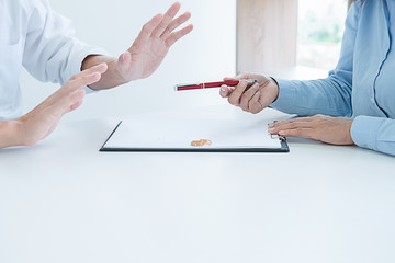 Judge gavel with Justice lawyers deciding, consultation on marriage divorce between married couple and signing divorce documents on table. Concepts of Law and Legal sevices.