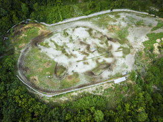 aerial view of mountain racecourse on the mountain field during summer day