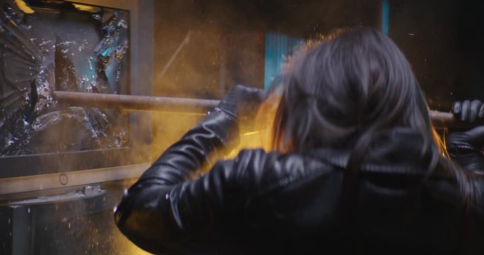 Smashing TV wall in slow motion with crowbar (4K)