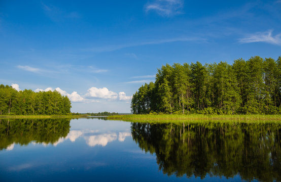 Beautiful landscape with reflection on a lake in wild Russia. The beauty of nature.