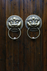 door handle with dragon design  on wooden door
