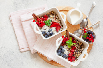 Healhty vegan breakfast bowl. Quinoa with cinnamon and fresh berries overhead
