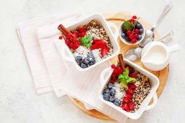 Healhty vegan breakfast bowl. Quinoa with cinnamon and fresh berries overhead