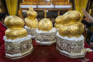 The Five balls of god (Glided Buddha statue) of Phaung Daw Oo pagoda in Inle lake, Myanmar.

